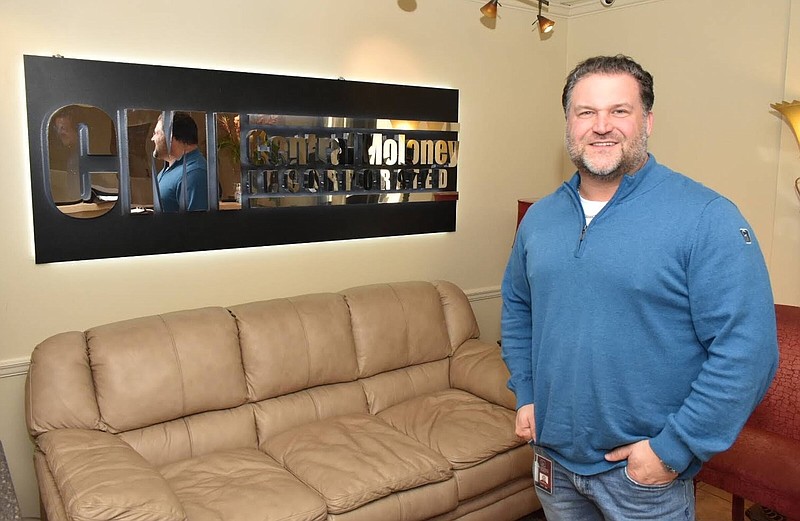 Central Moloney Inc. CEO Chris Hart poses in the lounge of the company's Pine Bluff headquarters in this Jan. 12, 2022, photo. (Pine Bluff Commercial/I.C. Murrell)