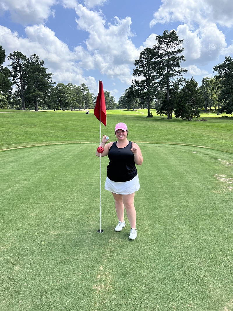 Karley Whittington poses after hitting her first hole-in-one. The shot was witnessed by her partner Jamie Barker during the first day of the Ouachita Valley Invitational. (Contributed photo)