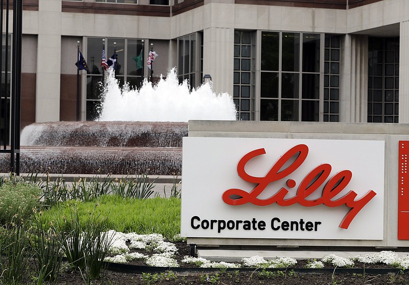 FILE- In this April 26, 2017, file photo shows the Eli Lilly and Co. corporate headquarters in Indianapolis. Shares of Eli Lilly and Co. jumped early Thursday, June 24, 2021, after the drugmaker said it will seek approval for its potential Alzheimers treatment later this year. (AP Photo/Darron Cummings, File)
