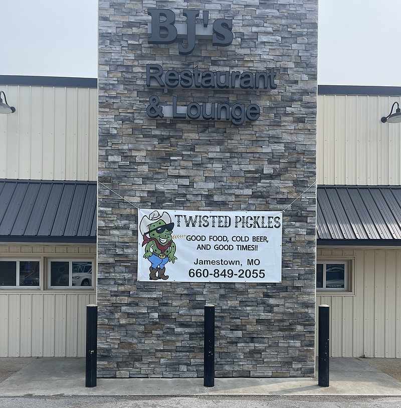 Courtesy/ Deanna Harris 
Twisted Pickles second location in Linn, Missouri, hangs a new sign on its front entrance, signaling the end of BJ's Restaurant and Lounge and the beginning of new ownership.