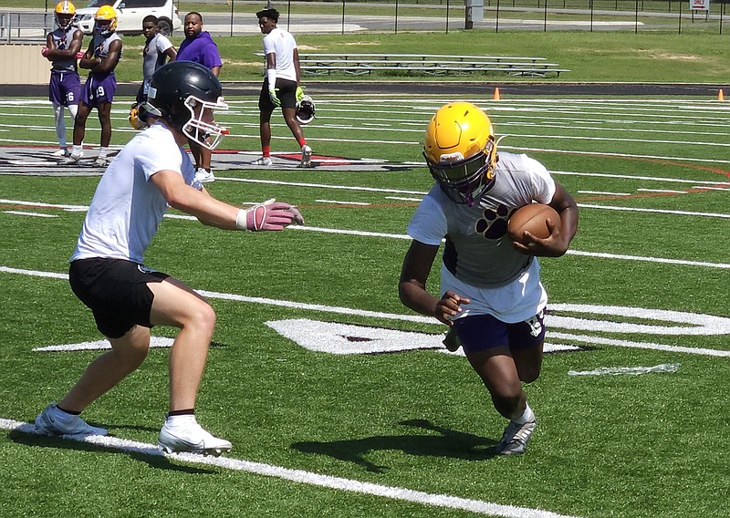 Dumas sophomore Marion Grant carries the ball after a catch Wednesday during a 7-on-7 camp at White Hall. (Pine Bluff Commercial/Tanner Spearman)