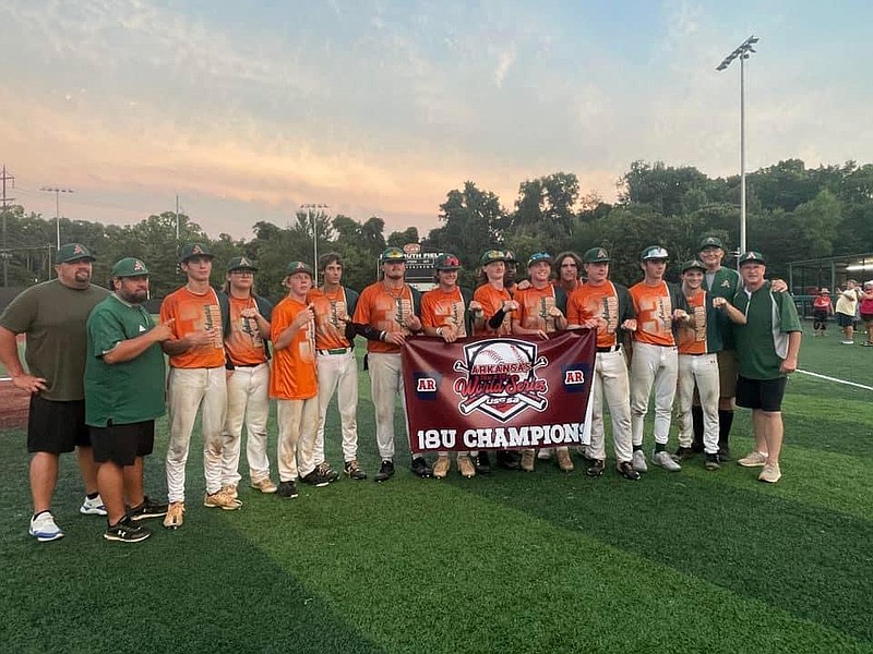 The Arkansas Pulpwood 18U Baseball team pose with its championship banner after winning the USSSA World Series earlier this week. (Contributed photo)