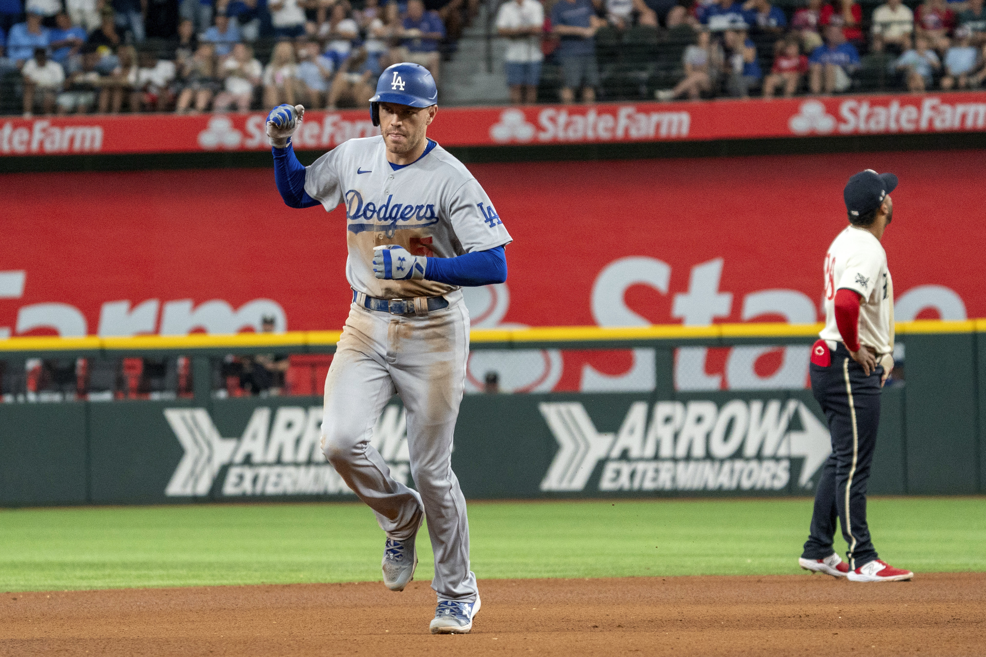 Los Angeles Dodgers' Miguel Rojas (11) celebrates on second base