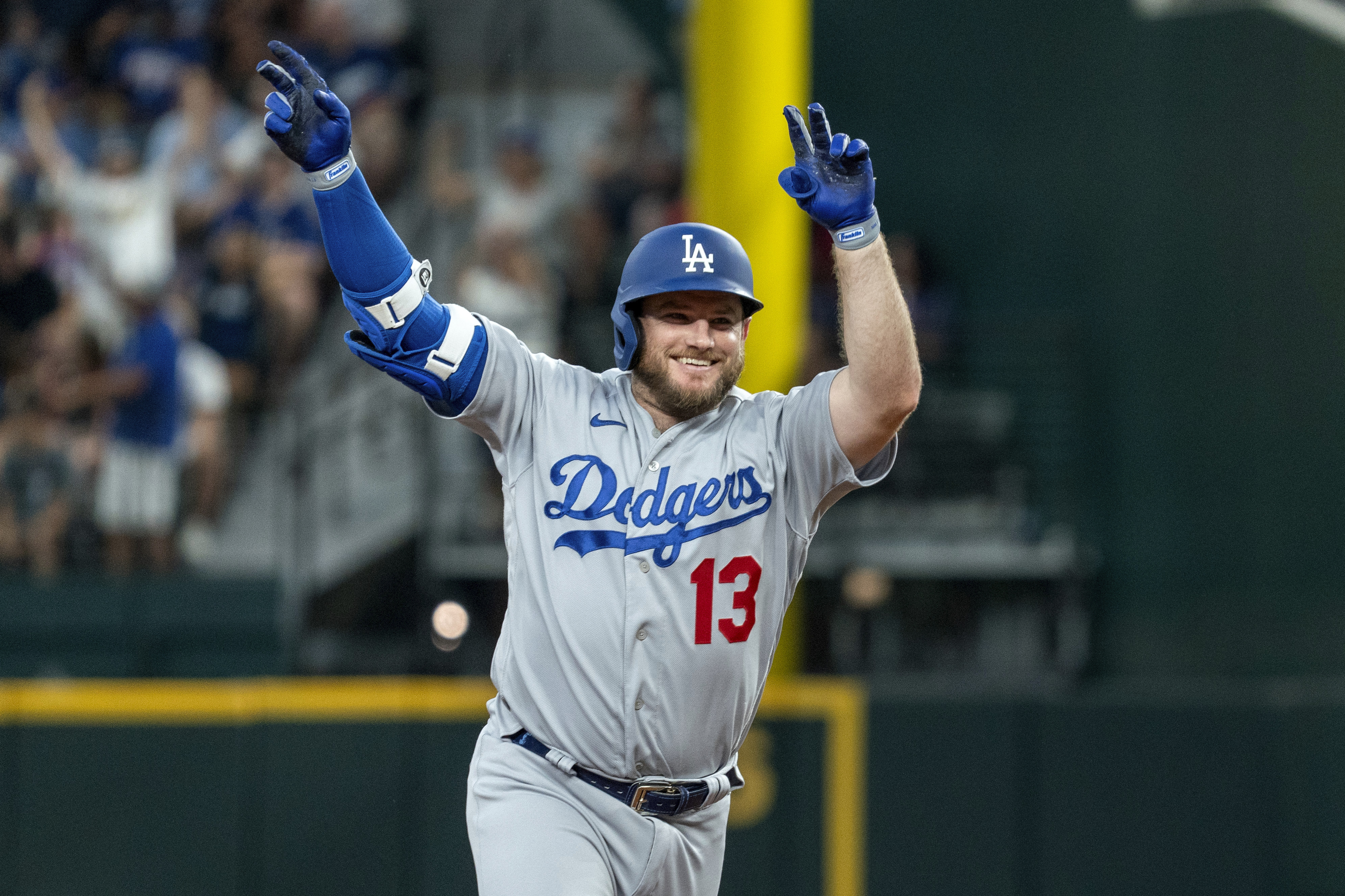 Los Angeles Dodgers second baseman Max Muncy (13) is congratulated