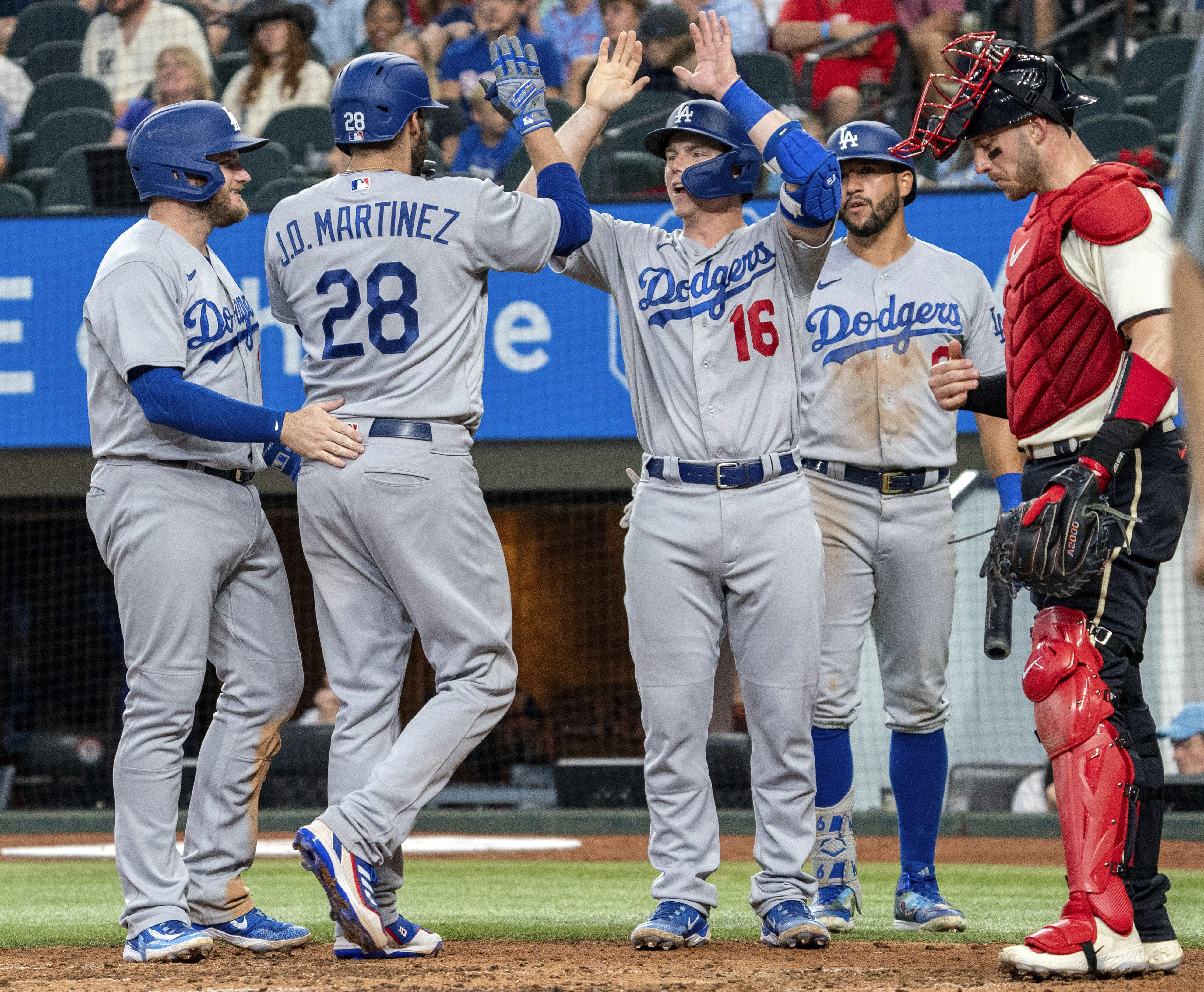 Los Angeles Dodgers' Jonny Deluca celebrates as he rounds firs