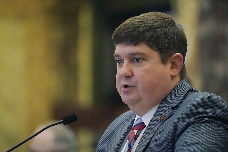FILE - State Sen. Jeremy England, R-Vancleave, presents legislation in the Senate Chamber at the Mississippi Capitol in Jackson, Feb. 1, 2023. England says he intentionally wore an embarrassing Halloween costume to raise money for breast cancer research — a shiny pink bodysuit with a short pink skirt. Now, three years later, England says a photo of him in the outfit is being misused in an increasingly divisive GOP primary as he supports Lt. Gov. Delbert Hosemann for reelection. (AP Photo/Rogelio V. Solis, File)
