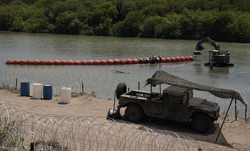 U.S. Sues Abbott Over Texas’ Floating Barrier | The Arkansas Democrat ...