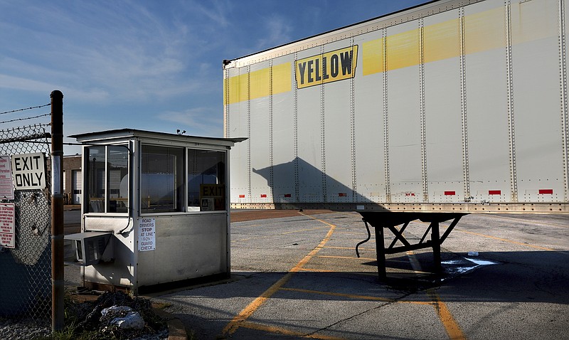 A Yellow box trailer blocks the entrance to the shuttered YRC Freight terminal in St. Louis, on Monday, July 31, 2023. Troubled trucking company Yellow Corp. is shutting down and filing for bankruptcy, the Teamsters said Monday. An official backruptcy filing is expected any day for Yellow, after years of financial struggles and growing debt. (Robert Cohen/St. Louis Post-Dispatch via AP)