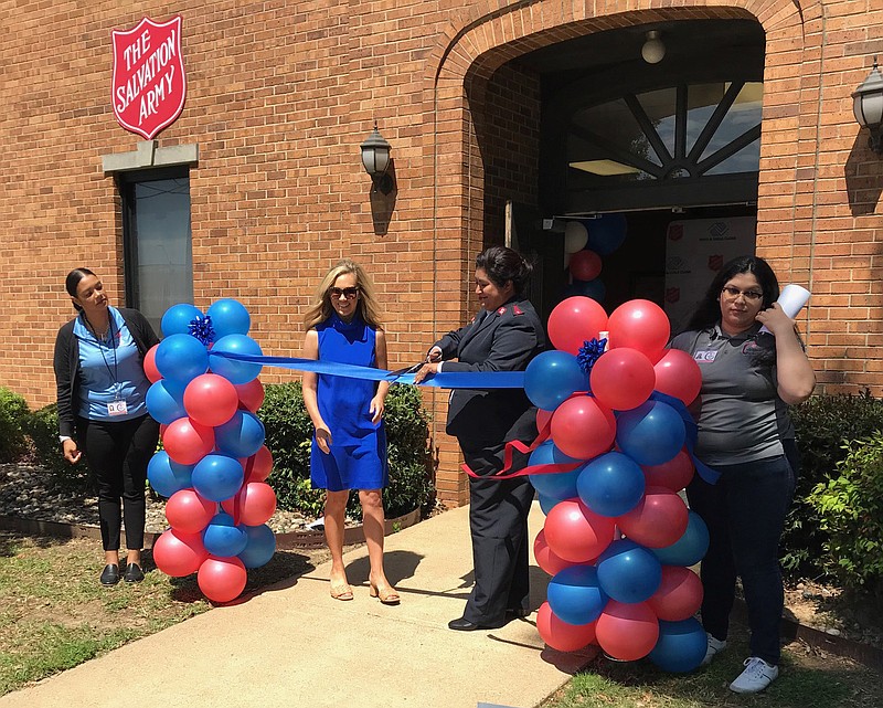 Capt. Clara Gomez of The Salvation Army cuts a ceremonial ribbon during the grand opening of the Boys & Girls Club on Monday, April 24, 2023, in Texarkana, Ark. The club is open to Arkansas and Texas children ages 7 to 14. (Staff file photo by Greg Bischof)