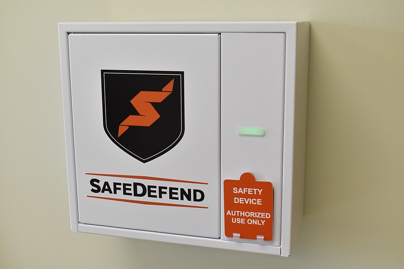 Democrat photo/Garrett Fuller — A new SafeDefend safe and activation button is seen Aug. 4 at the district's central office inside California Middle School.