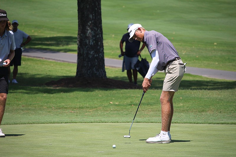 Hot Springs native Will Gordon putts on the ninth green during the Junior PGA Championships Friday at Hot Springs Country Club. - Photo by Krishnan Collins of The Sentinel-Record
