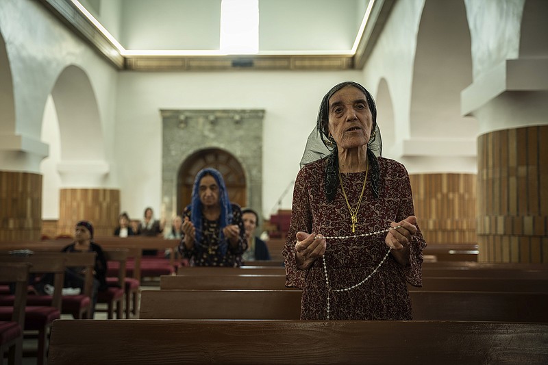 Chaldean Christians pray in St. George's Church in Irbil, Iraq, on Monday, July 31, 2023. Today, the number of Christians in Iraq is 150,000, compared to 1.5 million in 2003. (AP Photo/Julia Zimmermann/Metrography)