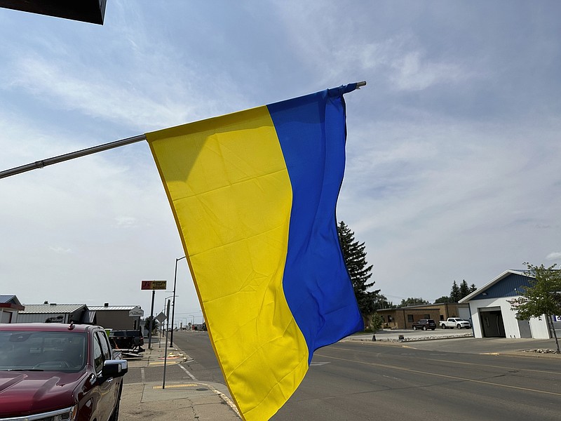 A Ukrainian flag flies outside the Ukrainian Cultural Institute in Dickinson, N.D., Monday, July 17, 2023. The institute preserves the area's Ukrainian heritage with its museum, library and meals. (AP Photo/Jack Dura)