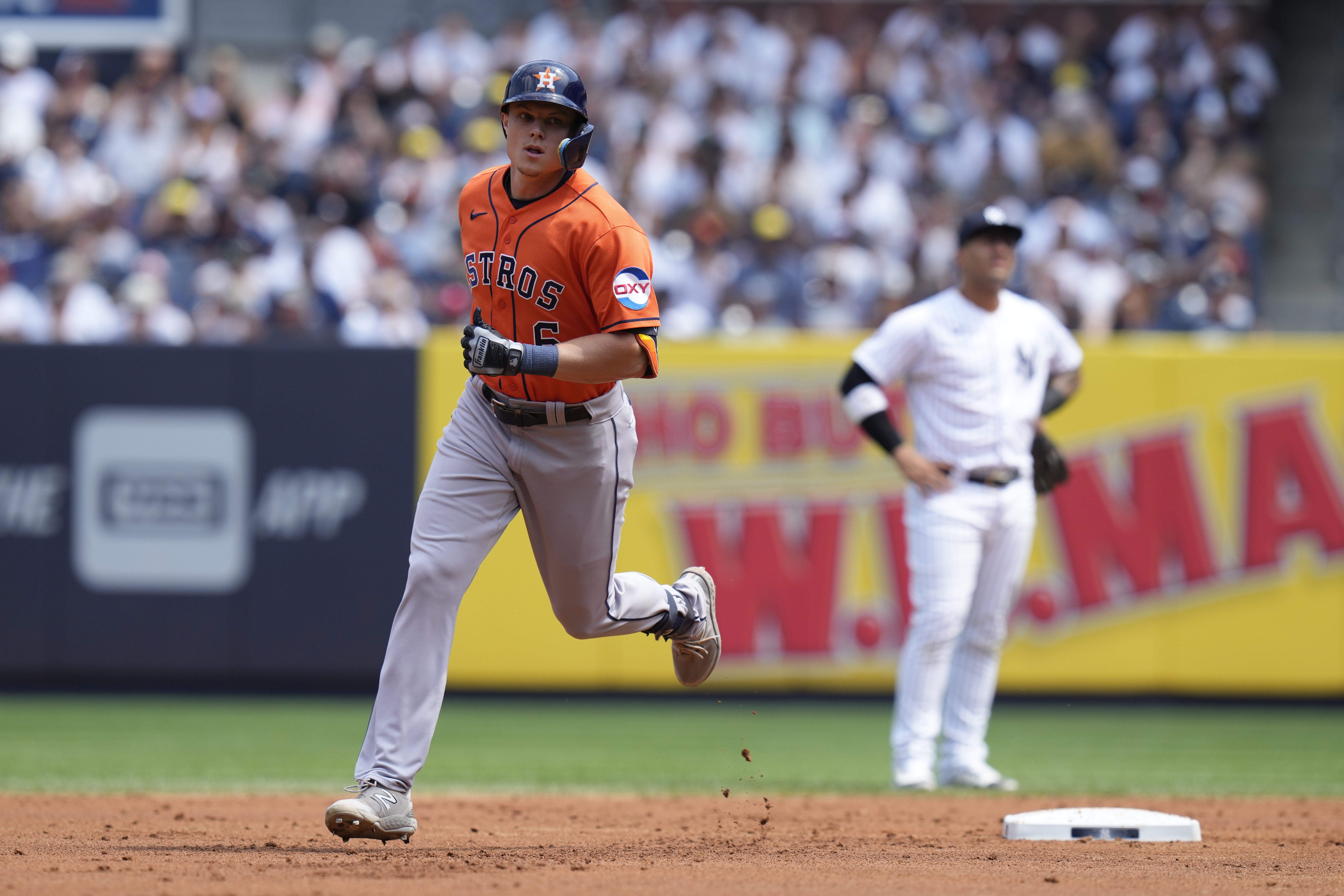 Houston Astros center fielder Jake Meyers signs an autograph after