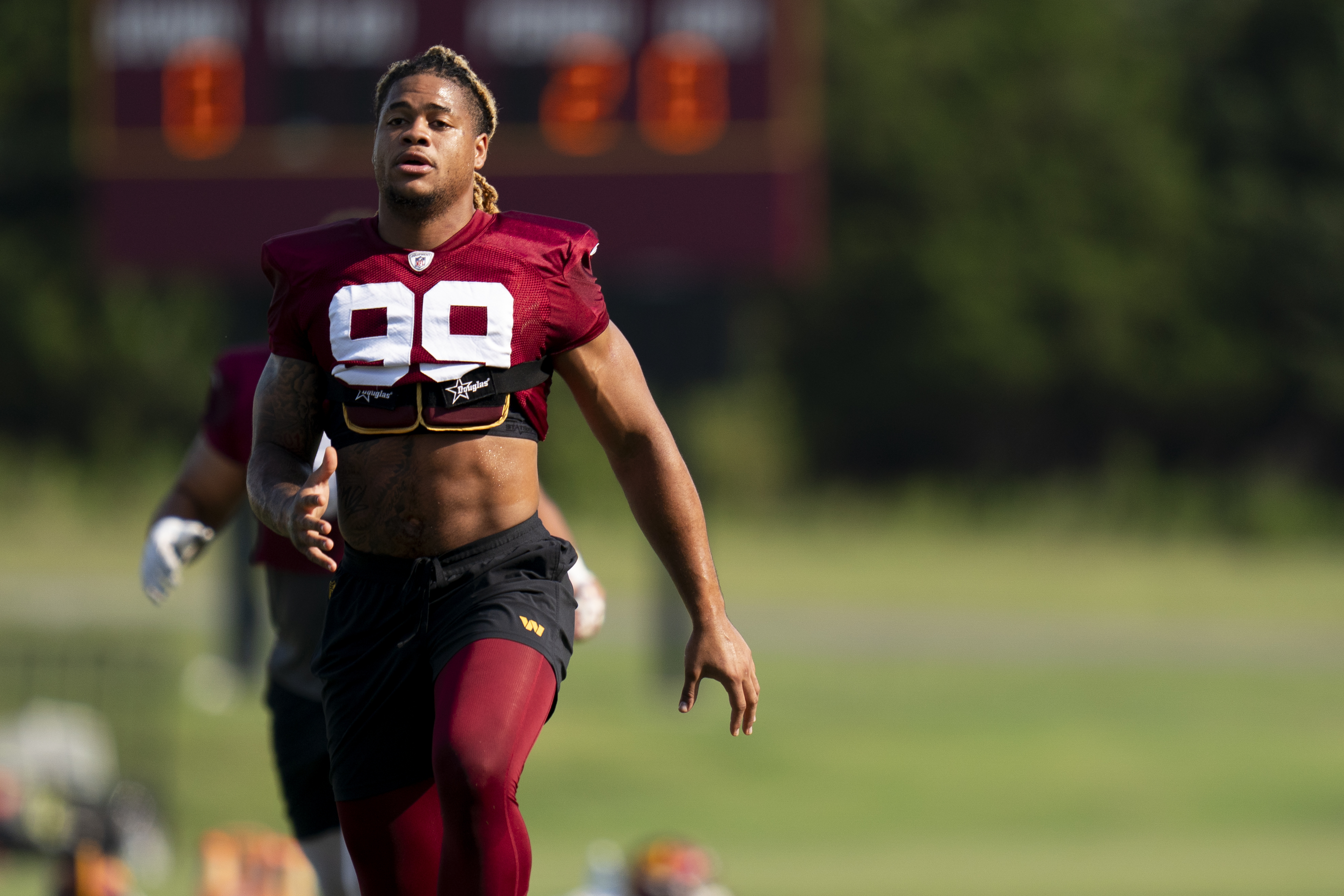 Washington Commanders defensive end Chase Young (99) runs during NFL  football practice at the team's training facility, Wednesday, July 26, 2023  in Ashburn, Va. (AP Photo/Alex Brandon Stock Photo - Alamy