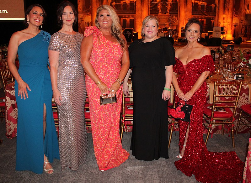Mandy Macke, executive director of the Willard & Pat Walker Charitable Foundation, Inc. (center), is joined by Chelsea Hermez (from left), Casey Hamaker, Anne Jackson and Tareneh Manning at the 15th annual Gala of Hope on Aug. 4 at the Fayetteville Public Library. Macke announced a $25 million gift from the Walker Foundation to Arkansas Children's Northwest at the Casino Royale-themed fundraiser.
(NWA Democrat-Gazette/Carin Schoppmeyer)