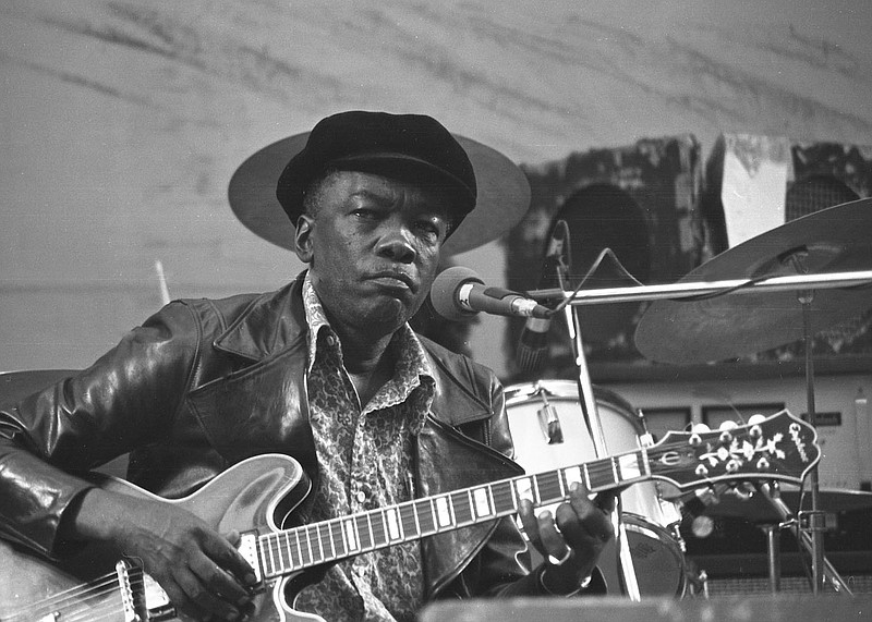 The Eureka Springs Historical Museum celebrates the 50th anniversary of the Ozark Mountain Folkfair, also called the "Woodstock of the Ozarks," which happened May 26-28, 1973. Tonight's reception will include photography by Albert Skiles and Jim Mathis, as well as historical objects and rare band memorabilia. Pictured is John Lee Hooker at the Ozark Mountain Folkfair in 1973. (Courtesy Photo/Jim Mathis)
