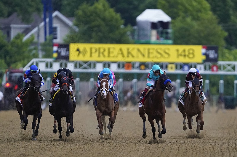 FILE - Horses compete during the148th running of the Preakness Stakes horse race at Pimlico Race Course, Saturday, May 20, 2023, in Baltimore. Preakness officials say they are considering moving the second Triple Crown race back to four weeks after the Kentucky Derby instead of two weeks later, which would change the timing that has been in place for more than half a century. Aidan Butler, CEO of 1/ST Racing, which owns and runs Pimlico Race Course in Baltimore where the Preakness is run, said it's necessary to take a close look at making changes, citing horse safety among the reasons. (AP Photo/Nick Wass, File)
