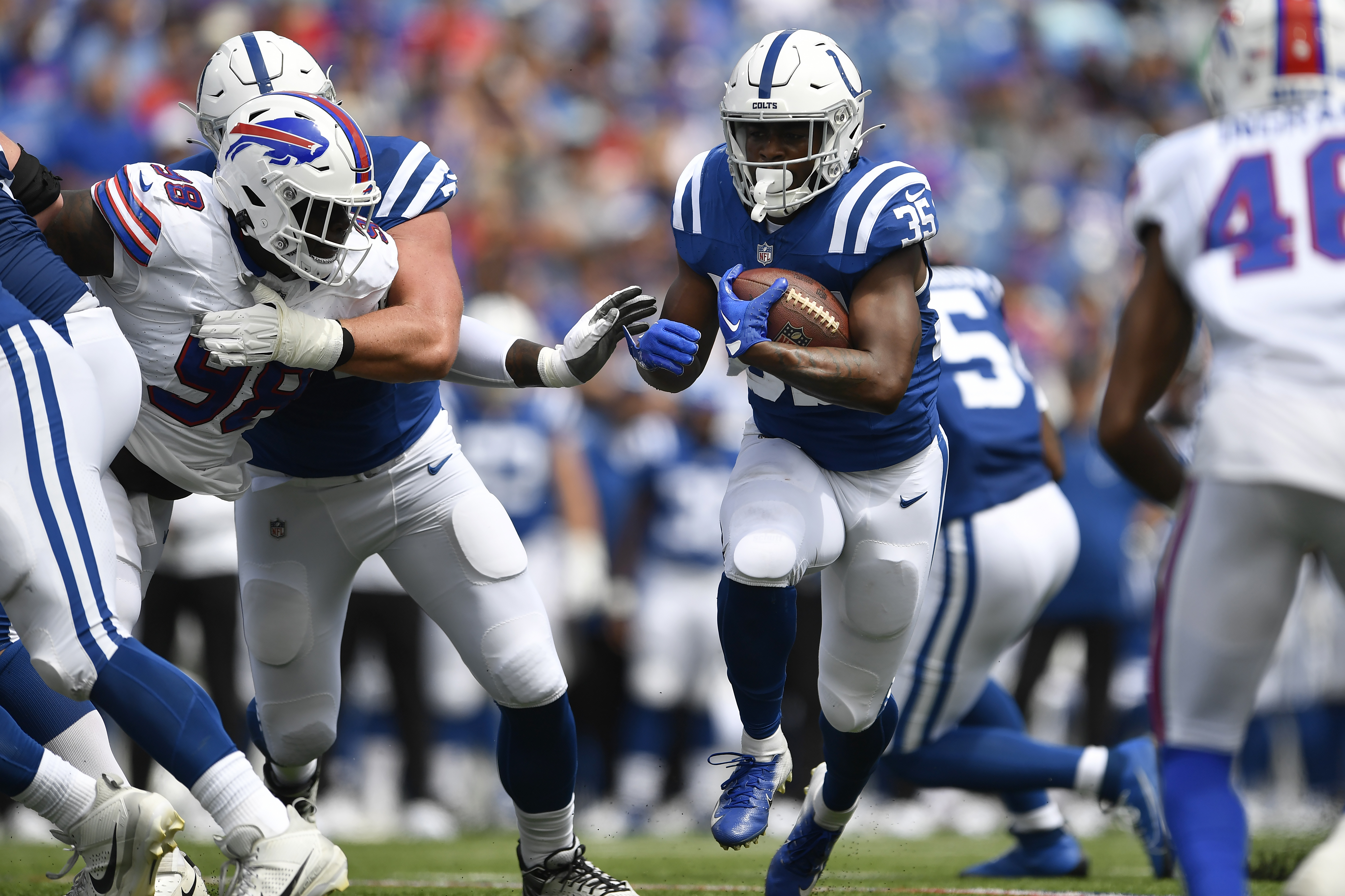 Indianapolis Colts running back Jake Funk (37) runs with the ball during  the first half an NFL preseason football game against the Buffalo Bills in  Orchard Park, N.Y., Saturday, Aug. 12, 2023. (