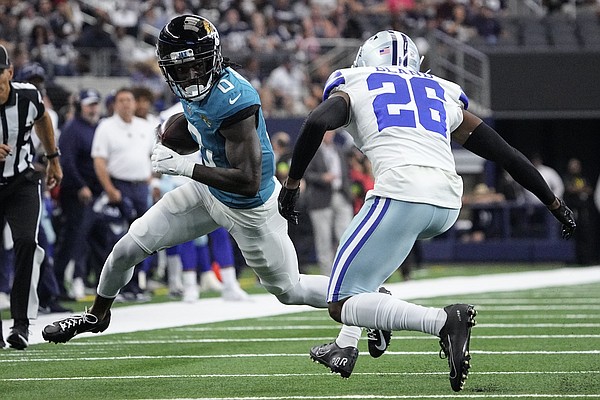 Dallas Cowboys running back Rico Dowdle (23) fumbles the ball