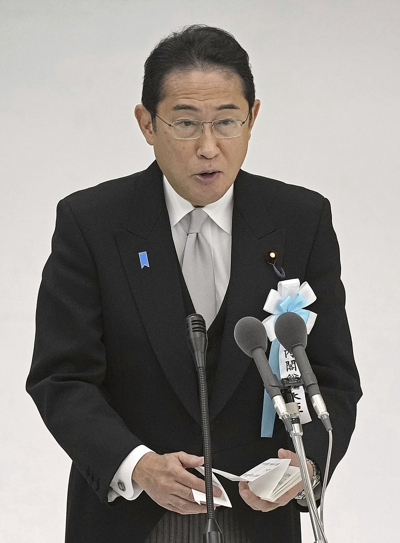 Japan's Prime Minister Fumio Kishida delivers a speech during the memorial service for the war dead, as Japan marks the 78th anniversary of Japan's World War II defeat, at the Nippon Budokan hall in Tokyo, Tuesday, Aug. 15, 2023.(Kyodo News via AP)