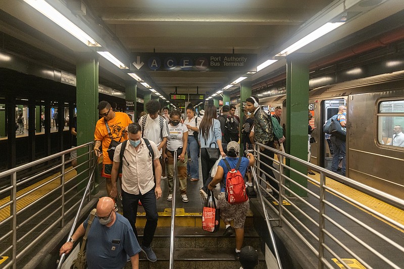 Commuters in New York City. MUST CREDIT: Bloomberg photo by Jeenah Moon