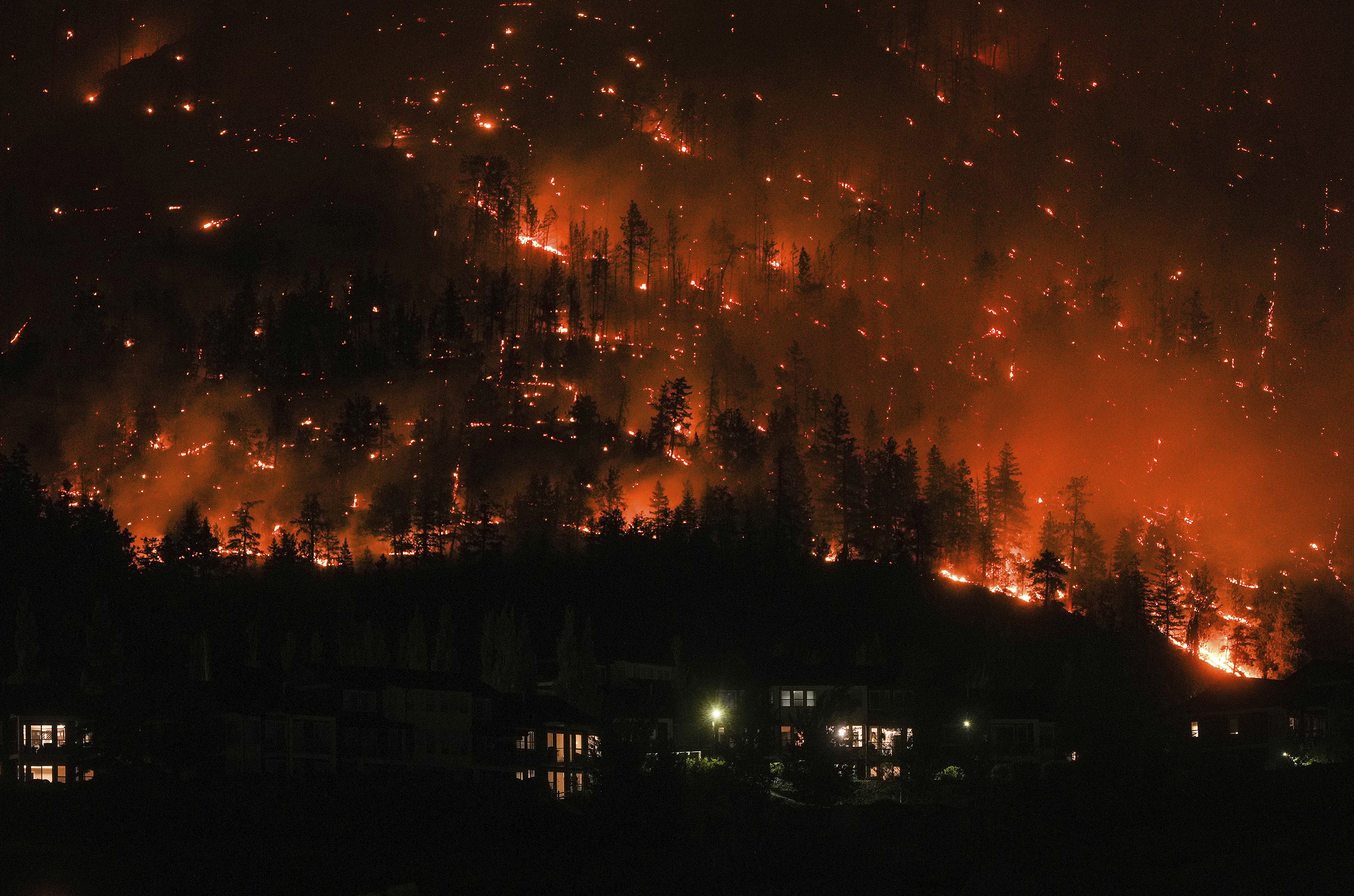 Firefighters curb blazes threatening 2 cities in western Canada but are 'not out of the woods yet' - Vimarsana News