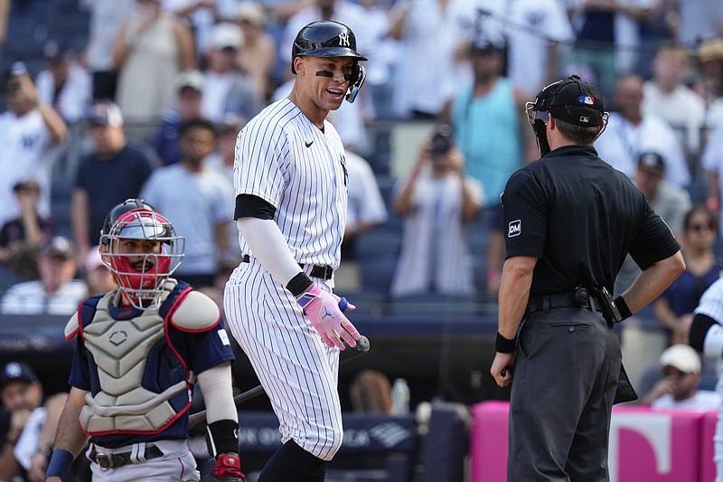 New York Yankees' Aaron Judge, center, argues a call with home plate umpire Fieldin Culbreth, right, as catcher Reese McGuire watches during the ninth inning of a baseball game Sunday, Aug. 20, 2023, in New York. The Red Sox won 6-5. (AP Photo/Frank Franklin II)