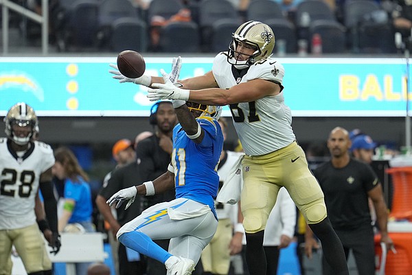 New Orleans Saints quarterback Jameis Winston (2) is flipped over