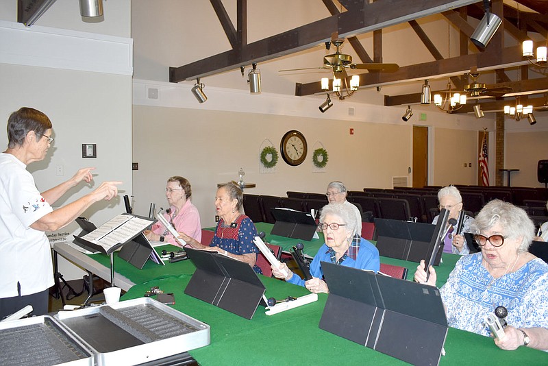 Hand chime choir members find happiness in making music at Concordia