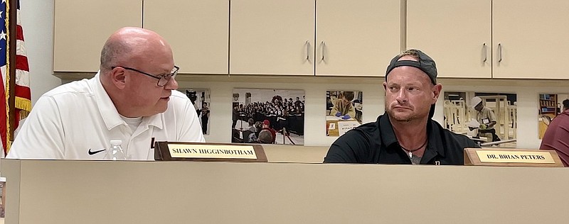 Lake Hamilton School Board President Dr. Brian Peters, right, looks on as Superintendent Shawn Higginbotham speaks during a school board meeting in August 2022.  - File photo by Brandon Smith of The Sentinel-Record