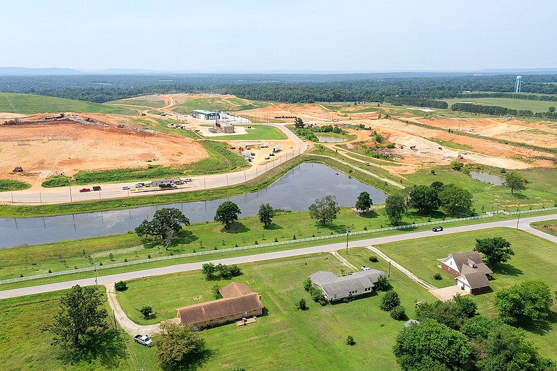 Houses are seen on Arbor Acres Road beside the Eco-Vista Landfill in Tontitown on June 25, 2023.
(File Photo/NWA Democrat-Gazette/Spencer Tirey)