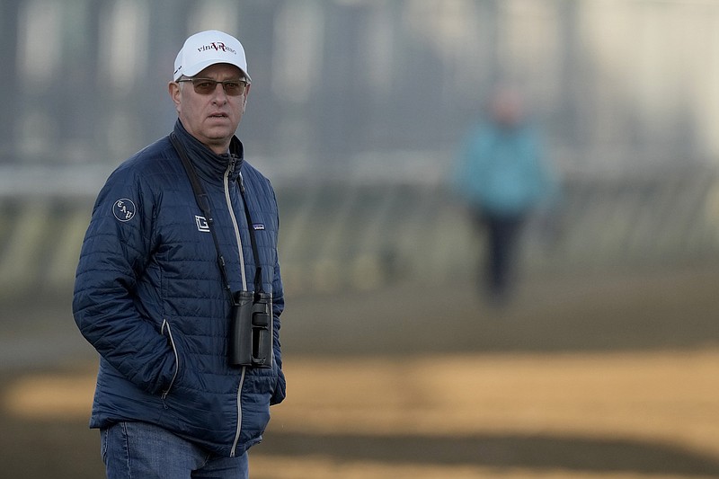 Trainer Todd Pletcher watches a workout at Churchill Downs May 2 in Louisville, Ky. - Photo by Charlie Riedel of The Associated Press