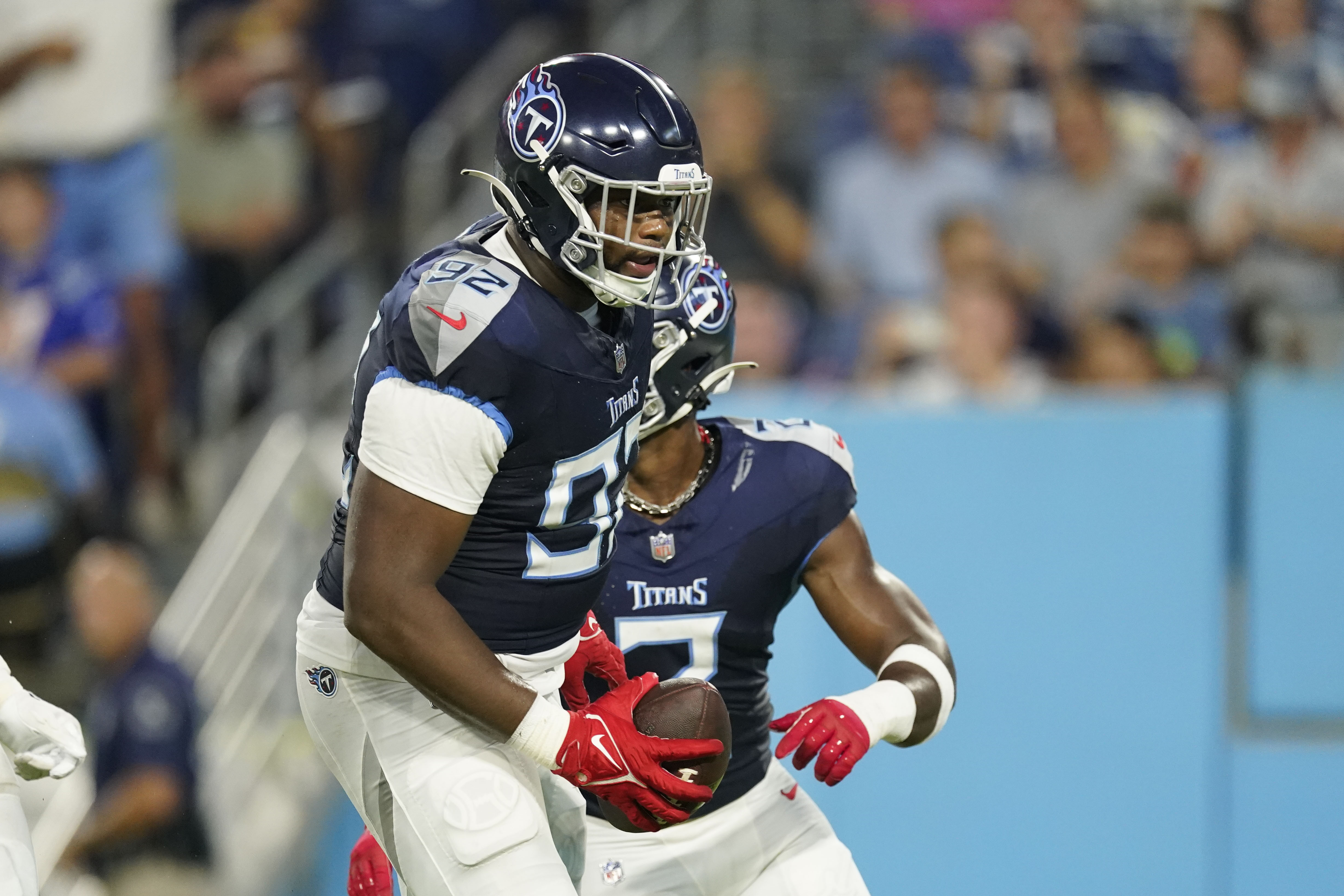 NASHVILLE, TN - AUGUST 20: Tennessee Titans quarterback Malik Willis (7)  turns to hand the ball off during the Tampa Bay Buccaneers-Tennessee Titans  Preseason game on August 20, 2022 at Nissan Stadium