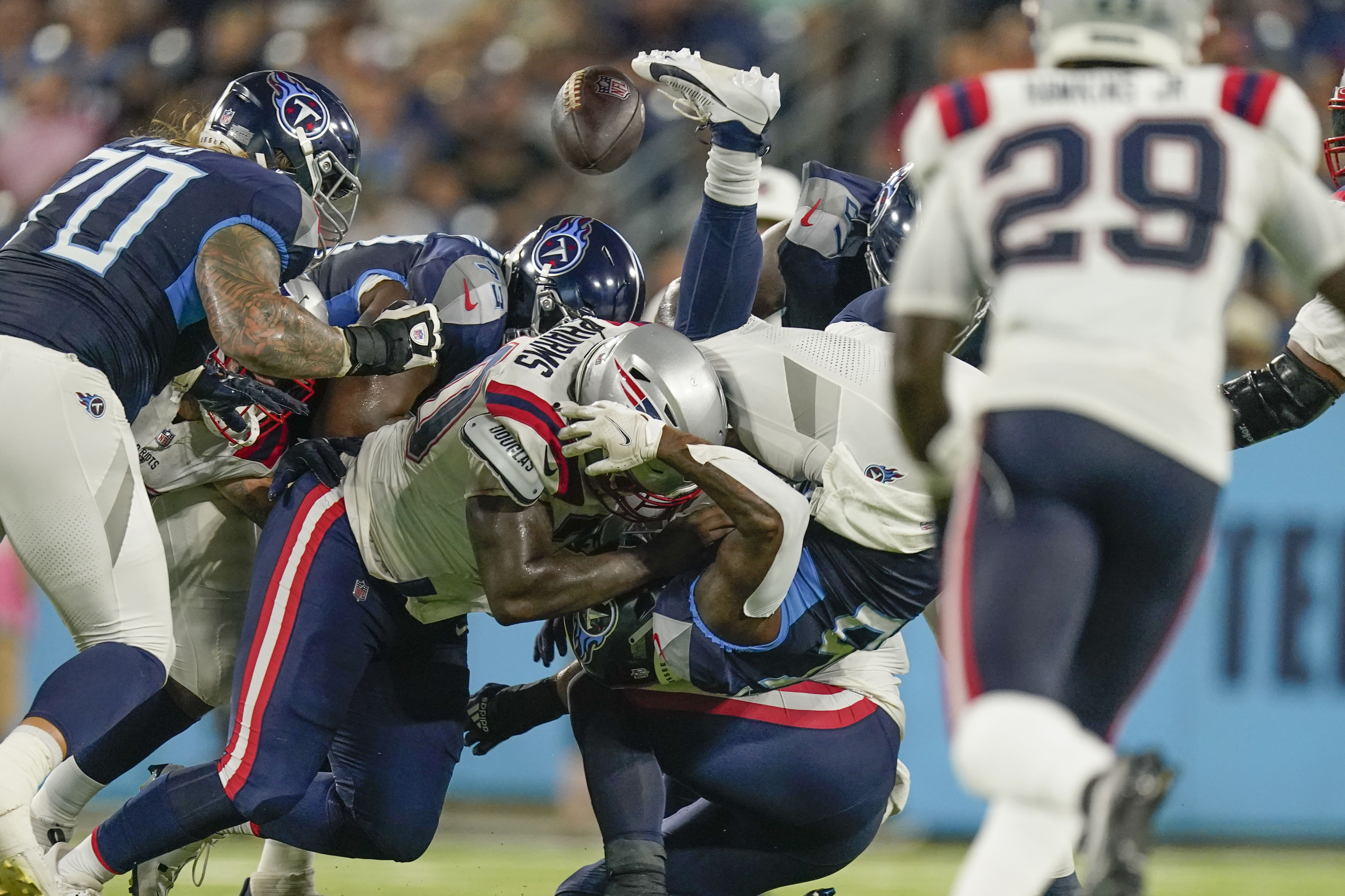 NASHVILLE, TN - AUGUST 20: Tennessee Titans quarterback Malik Willis (7)  catches the snap during the Tampa Bay Buccaneers-Tennessee Titans Preseason  game on August 20, 2022 at Nissan Stadium in Nashville, TN. (