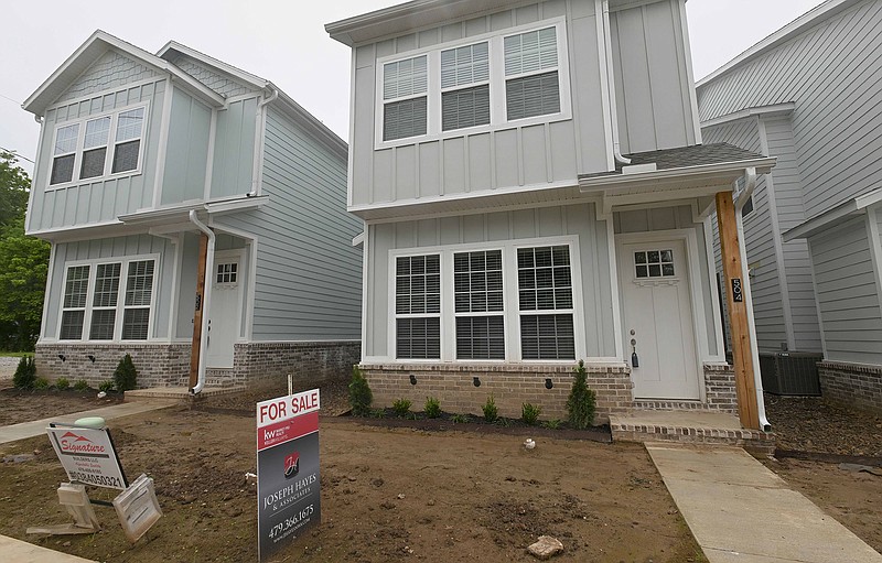 Town homes are shown, Tuesday, May 16, 2023 along Persimmon St. in Rogers.  (NWA Democrat-Gazette/Charlie Kaijo)