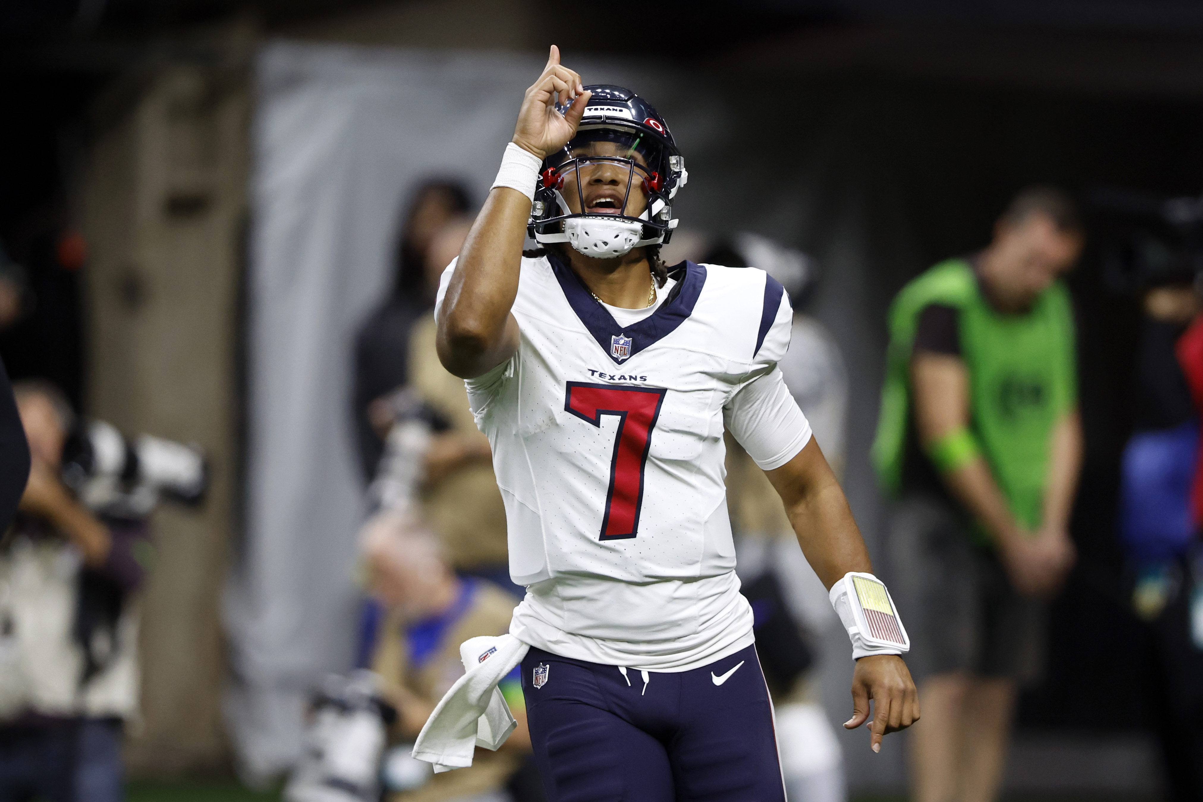 New Orleans, USA. 27th Aug, 2023. Houston Texans quarterback C.J. Stroud  (7) attempts a pass while facing a heavy pass rush from New Orleans Saints  defensive ends Tanoh Kpassagnon (92) and Carl