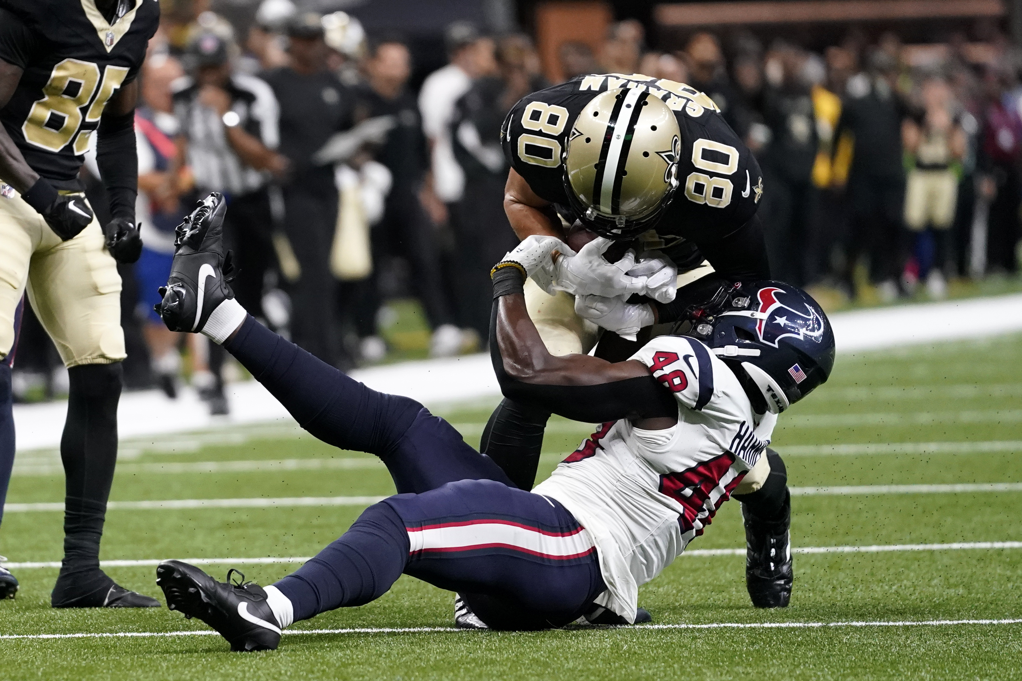 With only seconds left in the game New Orleans Saints tight end Jimmy  Graham (80) takes a Drew Brees pass 12 yards to setup the game winning 31  yard field goal by