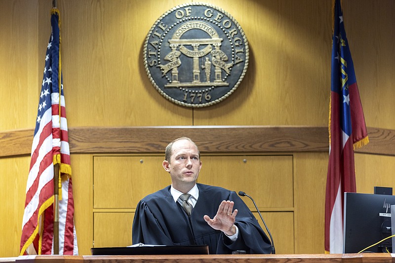 Fulton County Superior Court Judge Scott McAfee presides over a hearing regarding media access in the case against former President Donald Trump and 18 others at the Fulton County Courthouse in Atlanta, Thursday, Aug, 31, 2023. (Arvin Temkar/Atlanta Journal-Constitution via AP, Pool)