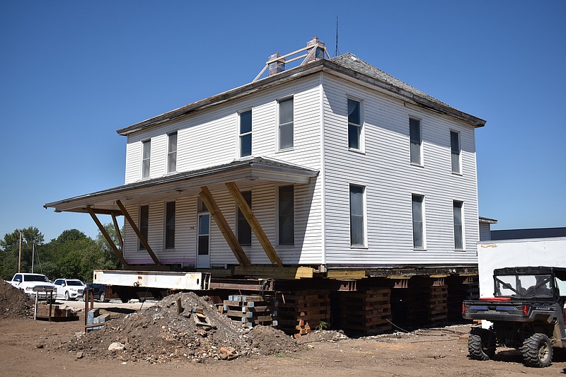 Democrat photo/Garrett Fuller — A two-story home that housed a Civil War captain, J.F. Tising's family and part of the Ramer family is seen lifted on blocks Saturday in High Point after being prepared for its upcoming move. Steve Ramer, owner, is moving the house Wednesday east of the High Point R-III School. However, instead of traveling eastward on Route C, they will head west before going north on High Point Road to move behind a row of homes until reaching its final resting spot. Once there, he intends to restore the home for vacation rentals.