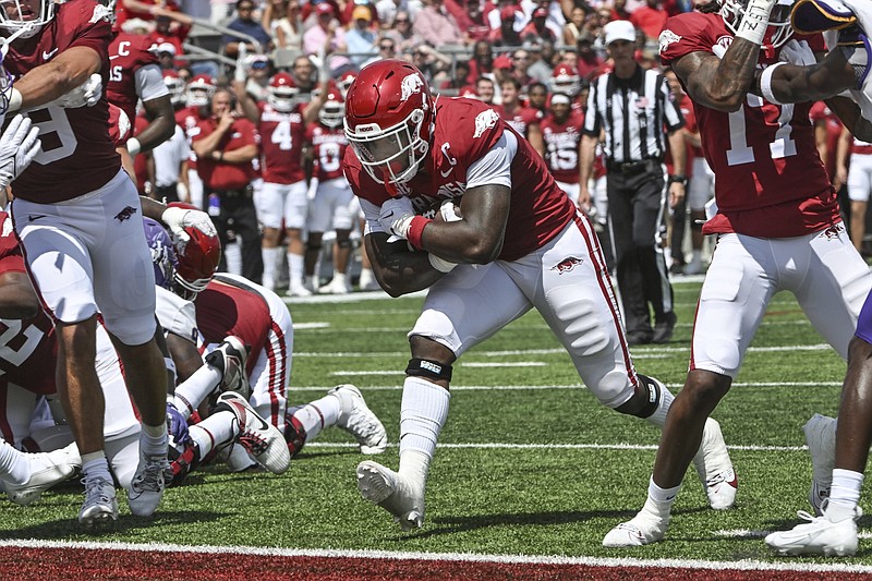 Arkansas running back Raheim Sanders (5) runs for a touchdown against Western Carolina Saturday in Little Rock. - Photo by Michael Woods of The Associated Press