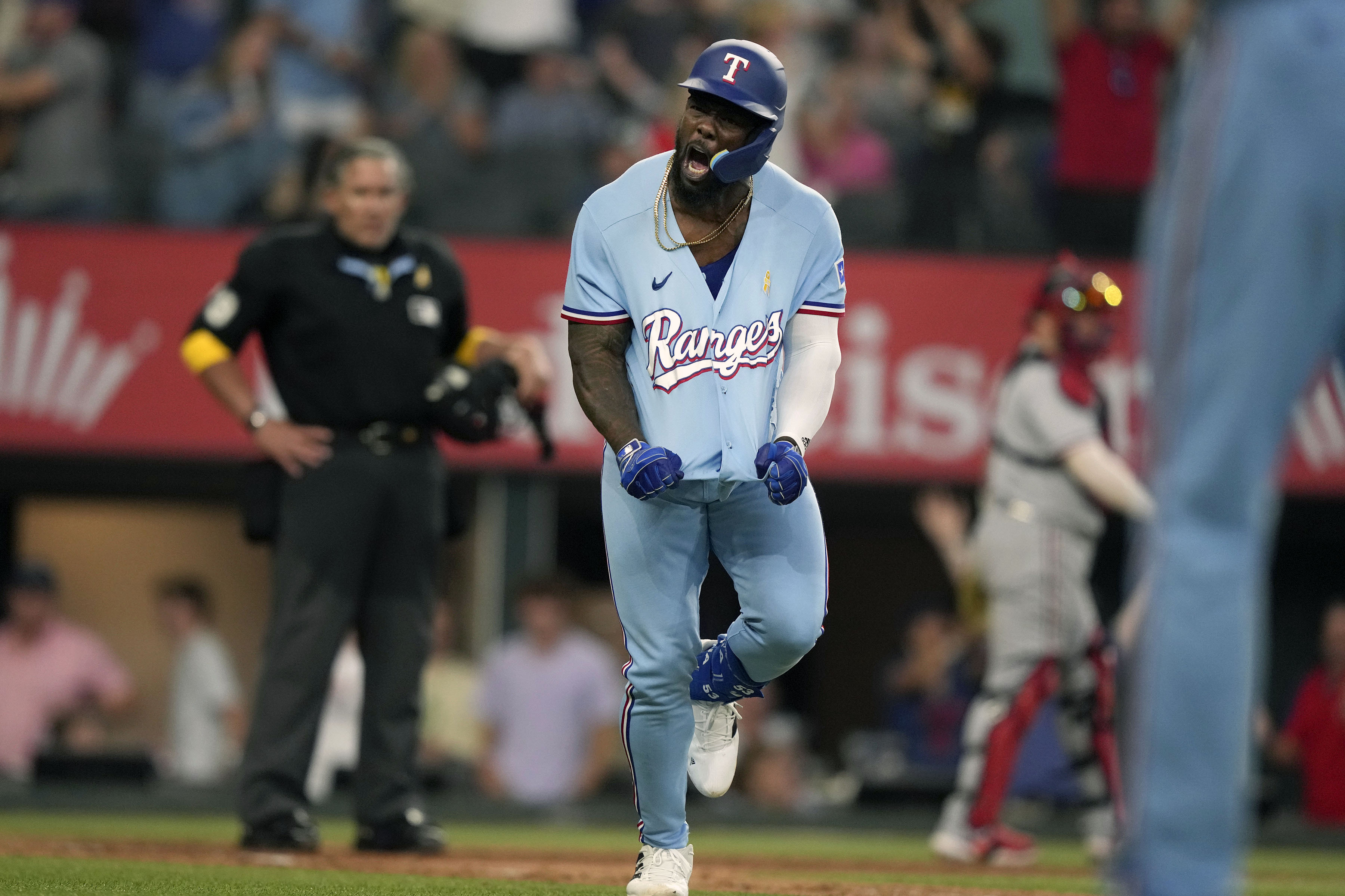 Texas Rangers' Nathaniel Lowe runs the bases after hitting a solo home run  during the fourth inning of a baseball game against the Cleveland Guardians  in Arlington, Texas, Friday, July 14, 2023. (