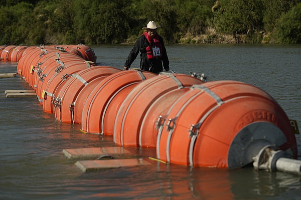 Texas told to move floating barrier Texas told to move floating barrier