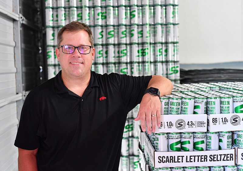 Jesse Core, founder and owner of Core Brewing/Scarlet Letter Beverage Company, poses Tuesday, Aug. 22, 2023, at the brewery in Springdale. Visit nwaonline.com/photo for today's photo gallery. 
(NWA Democrat-Gazette/Andy Shupe)