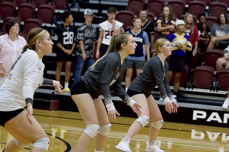 Mark Ross/Special to Herald-Leader
Siloam Springs defenders (from left) Trinity Collette, Cenzi Johnson and Natalie Ross await a serve against Carthage, Mo., on Aug. 31.