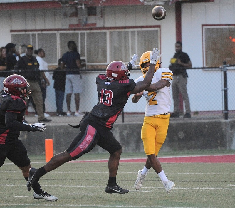 Pine Bluff defender Leon Williams (left) puts pressure on Watson Chapel quarterback Malachi Rayford during Friday night’s game at Jordan Stadium in Pine Bluff. The Zebras won 60-8.
(Special to the Pine Bluff Commercial/William Harvey)