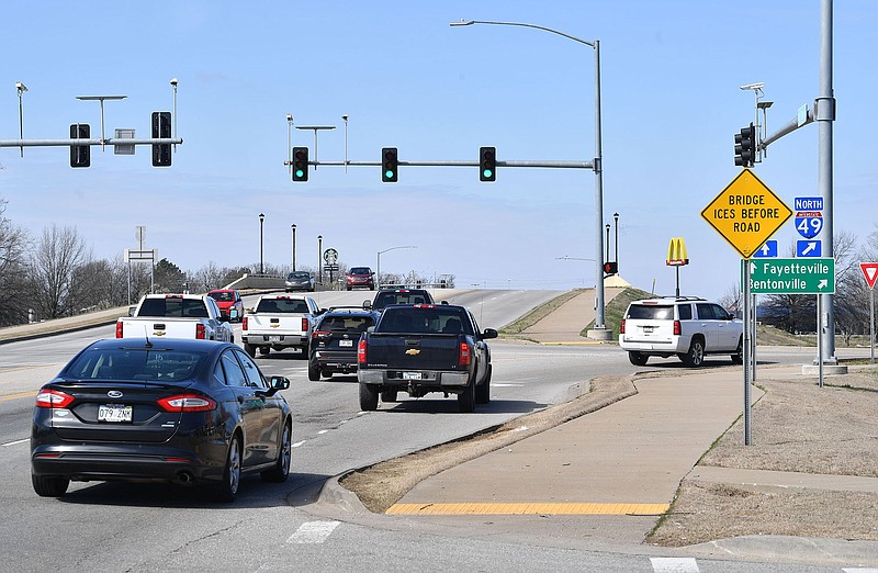 Traffic passes Monday, March 13, 2023, along Elm Springs Road past the roads interchange with Interstate 49 in Springdale. (NWA Democrat-Gazette/Andy Shupe)
