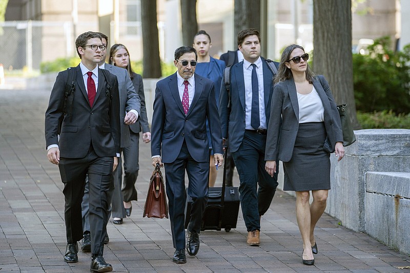 U.S. Department of Justice lawyers, including Kenneth Dintzer, center, and Megan Bellshaw, right, arrive at the E. Barrett Prettyman U.S. Federal Courthouse, Tuesday, Sept. 12, 2023 in Washington. Google will confront a threat to its dominant search engine beginning Tuesday when federal regulators launch an attempt to dismantle its internet empire in the biggest U.S. antitrust trial in a quarter century. (AP Photo/Nathan Howard)