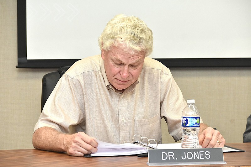 White Hall School District Board President Dr. Raymond Jones reads a list of accomplishments during a board meeting Tuesday, Sept. 12, 2023. (Pine Bluff Commercial/I.C. Murrell)
