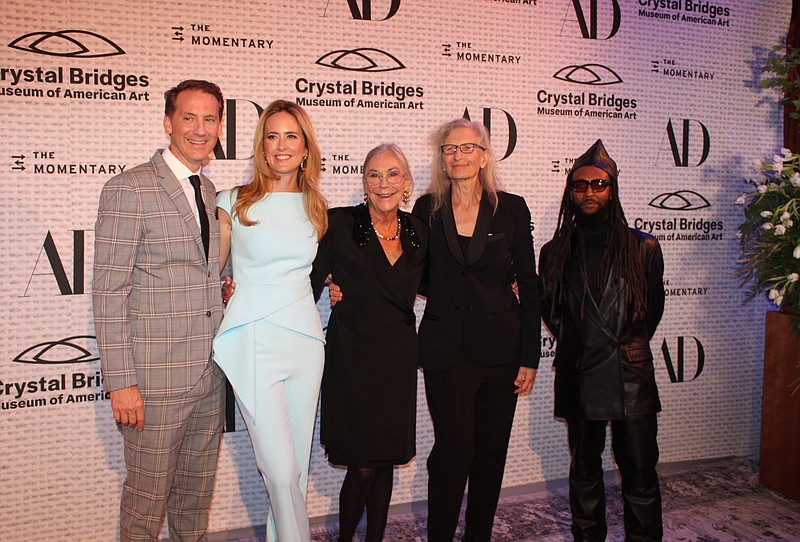 Rod Bigelow, Crystal Bridges Museum of American Art executive and chief diversity & inclusion officer (from left), Olivia Walton,  board chairperson; Alice Walton, chair emeritus and board member; Annie Leibovitz; and Awol Erizku; The Party at Crystal Bridges: A Dance with the Light chairs welcome guests to the benefit Sept. 14 at the museum in Bentonville. Proceeds will help support arts education at the museum.
(NWA Democrat-Gazette/Carin Schoppmeyer)
